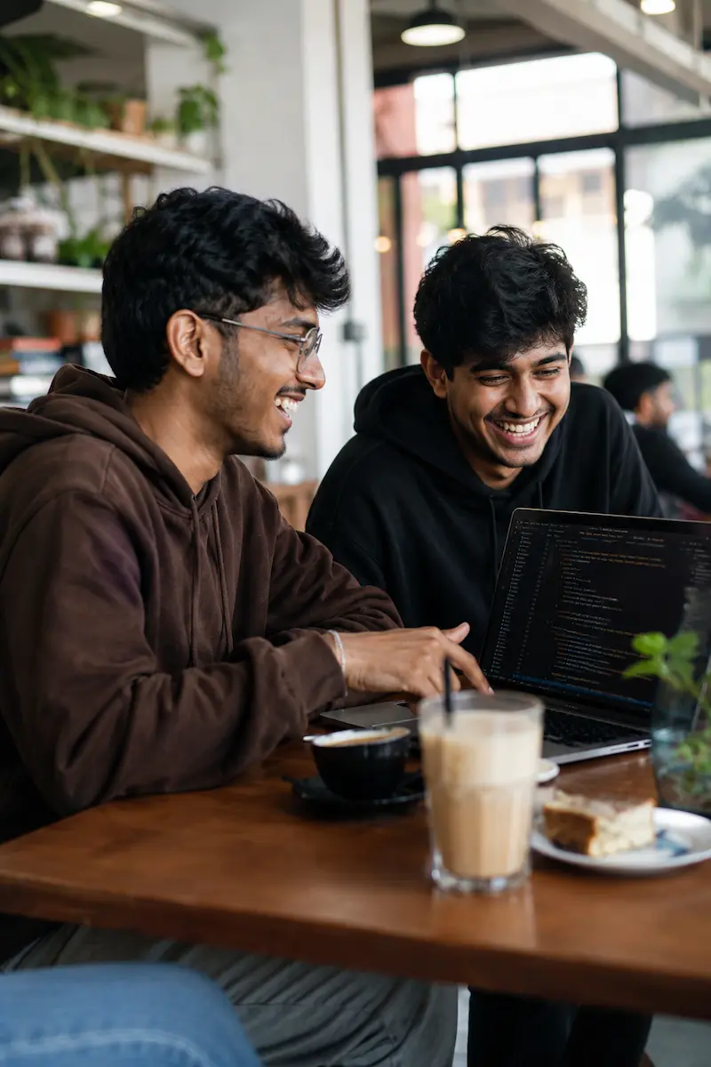 BlueTick students working together at a café